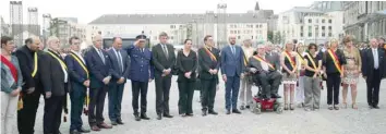  ?? — AFP ?? Belgian Prime Minister Charles Michel and officials respect a minute of silence during a tribute ceremony for the victims of a shooting in Liege on Wednesday.