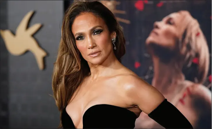  ?? PHOTOS BY JORDAN STRAUSS / INVISION / ASSOCIATED PRESS ?? Jennifer Lopez arrives at the premiere of “This Is Me ... Now: A Love Story” on Tuesday at the Dolby Theatre in Los Angeles.