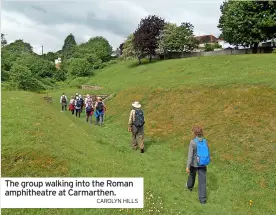  ?? CAROLYN HILLS ?? The group walking into the Roman amphitheat­re at Carmarthen.