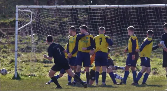  ??  ?? Seán Heffernan curls a free-kick wide for Newtown United.