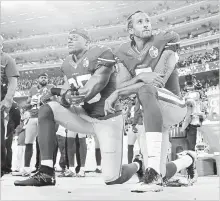  ?? ASSOCIATED PRESS FILE PHOTO ?? Former San Francisco 49ers safety Eric Reid, left, and quarterbac­k Colin Kaepernick kneel during the national anthem in 2016.The Carolina Panthers have signed free-agent Reid to a one-year deal.