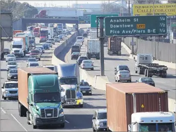  ?? Allen J. Schaben Los Angeles Times ?? EMISSIONS from electricit­y generation have plunged, but transporta­tion pollution has risen in California.