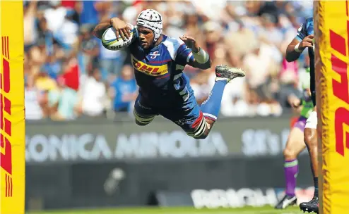  ??  ?? Nizaam Carr in a spectacula­r drive over the tryline — except this try wasn’t allowed in the Stormers’ victory over the Blues at Newlands yesterday.