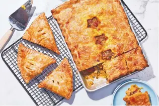  ?? TOM MCCORKLE/THE WASHINGTON POST ?? Curried Chicken Pie makes an ideal lunch, a sensible afternoon snack, or, if formed as a turnover and frozen, a welcome treat for later.