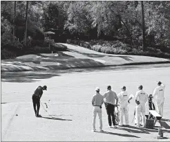  ?? CHARLIE RIEDEL/AP ?? Tiger Woods tees off on the 12th hole during Thursday’s first round of the Masters.