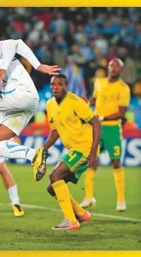  ??  ?? ABOVE: Goalkeeper Moeneeb Josephs is beaten by Alvaro Pereira of Uruguay during Bafana’s second Group A encounter. Bafana lost 3-0.