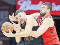  ?? TONY DEJAK THE ASSOCIATED PRESS ?? Marc Gasol, trying to separate the Cavaliers' Ante Zizic from the ball on Monday, will see a big increase in court time.