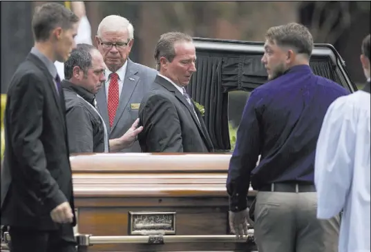  ?? Melissa Sue Gerrits The Associated Press ?? Relatives of Shanann Watts lift her casket into a hearse Saturday outside Sacred Heart Catholic Church in Pinehurst, N.C.