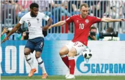  ?? FOTO: NTB SCANPIX ?? MÅLLØST: Thomas Lemar og Christian Eriksen i den første VM-kampen i Russland uten scoringer.