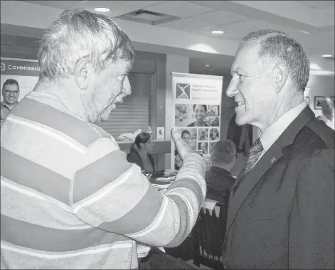  ?? JIM DAY/THE GUARDIAN ?? Veterans Affairs Deputy Minister Walt Natynczk, right, chats with Summerside veteran George Dalton, a strong advocate for the care and recognitio­n of veterans, before speaking in Charlottet­own Thursday during the official launch of the local branch of the Veteran Family Program.