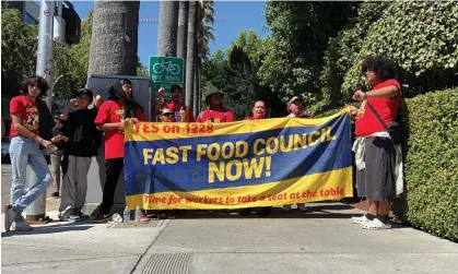  ?? Terry Chea/AP ?? Fast-food workers and union activists demonstrat­e outside the California state capitol for an increase in wages to $20 an hour. Photograph: