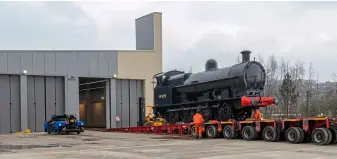  ?? ?? ABOVE ‘Super D’ No. 49395 is carefully unloaded into New Hall at Locomotion, Shildon, on March 7. SMG