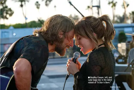  ?? Warner Bros. ?? ■ Bradley Cooper, left, and Lady Gaga star in the latest reboot of "A Star is Born."