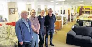  ??  ?? Showroom manager David Rahman (second left) with (from left) volunteer Brian and staff members Dave Edmonds and Mick Cavanagh