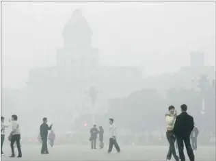  ?? CHINA PHOTOS/ GETTY IMAGES FILES ?? Severe air pollution — from smokestack emissions, vehicle exhaust, dust and aerosols — is a fact of life in Beijing, but the Chinese government often describes levels as ‘ slight.’