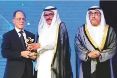  ?? Arshad Ali/Gulf News ?? Shaikh Hamdan Bin Rashid presents the Grand Hamdan Internatio­nal Award to Frederick S. Kaplan, professor of orthopaedi­c molecular medicine in the US, in the presence of Abdul Rahman Mohammad Al Owais in Dubai on Wednesday.