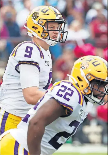  ?? [ROGELIO V. SOLIS/THE ASSOCIATED PRESS] ?? LSU quarterbac­k Joe Burrow is leading the nation with 29 touchdown passes and his 2,484 yards passing ranks second.