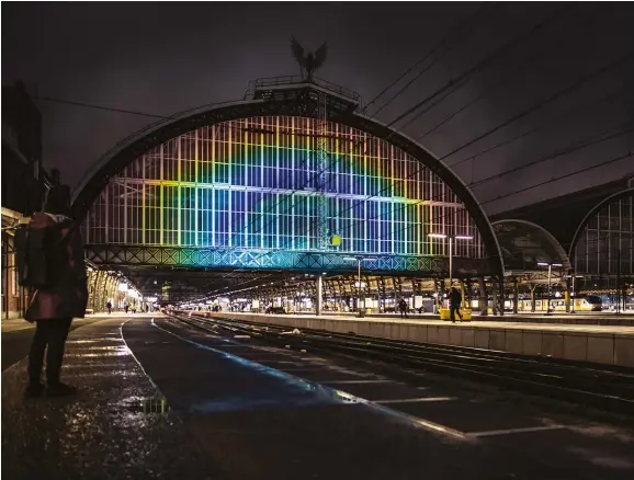  ??  ?? BELOW: Rainbow Station transforme­d Amsterdam’s Central Station with “the largest artificial rainbow in the world,” a feat achieved with new liquid crystal technology. The effect appeared within the hour after sunset.