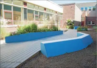  ??  ?? George Hollyer’s completed Eagle Scout project, a garden and Wallingfor­d Elementary School. learning space at