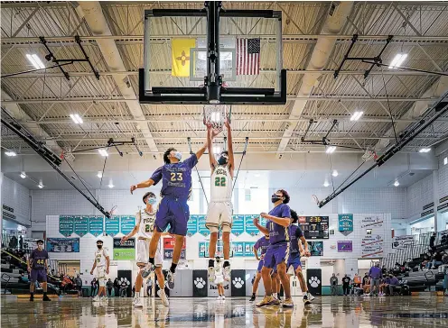  ?? GABRIELA CAMPOS/THE NEW MEXICAN ?? Pecos sophomore Joshua Gonzales scores on a layup during the second half of Thursday’s game against Kirtland Central. The Panthers rallied to win 67-54.