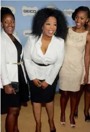  ?? — AP ?? Oprah Winfrey poses with students from the Oprah Winfrey Leadership Academy for Girls in South Africa at the 6th Annual Black Women in Hollywood Luncheon at the Beverly Hills Hotel in Los Angeles on Thursday.