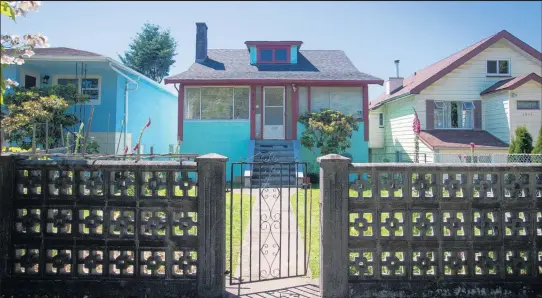  ?? Picture / Bloomberg ?? A modest house in Vancouver, on the market this year for C$ 1.4m ($ 1.48m).