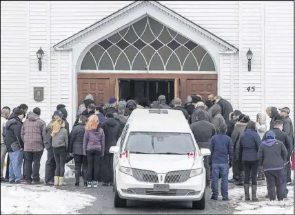  ?? ANDREW VAUGHAN – CANADIAN PRESS ?? Family and friends arrive at the funeral for Lionel Desmond and his mother Brenda Desmond at St. Peter’s Church in Tracadie, Jan. 11, 2017. Desmond killed his mother, wife and young daughter before taking his own life earlier in the month.