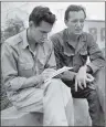  ??  ?? In this Aug. 1951 file photo, AP staffer Sam Summerlin, left, interviews Robert J. Santucci of Rochester, N.Y., a United Nations civilian stenograph­er who has been attending the Kaesong meetings, as they sit outside the entrance to the base camp at...