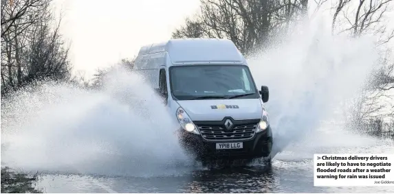  ?? Joe Giddens ?? Christmas delivery drivers are likely to have to negotiate flooded roads after a weather warning for rain was issued