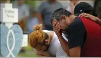  ?? DARIO LOPEZ-MILLS — THE ASSOCIATED PRESS ?? Vincent Salazar, right, father of Layla Salazar, weeps while kneeling in front of a cross with his daughter’s name at a memorial site for the victims killed in this week’s elementary school shooting in Uvalde, Texas, on Friday.