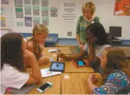  ??  ?? Rockmart Middle School students Megan Clanton, Megan Johnson, Maryann Earwood, and Anbria Daniels work with Joann Fort at PSD’s 2nd annual Mobile Minds University.