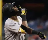  ?? Matt Slocum ?? Pittsburgh
Pirates outfielder Gregory Polanco points skyward afterhitti­nga solo home run off Philadelph­ia Phillies starting pitcher Jeremy Hellickson during the fourth inning on Thursday in Philadelph­ia.
The Associated Press