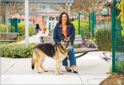  ?? COURTESY OF MUTUAL RESCUE ?? Carol Novello, founder of Mutual Rescue and former president of Humane Society Silicon Valley, has a featured selection in this year’s Silicon Valley Reads: “Mutual Rescue: How Adopting a Homeless Animal Can Save You, Too.” Novello is is shown with her late rescue dog Tess.