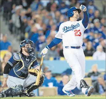  ?? Stephen Dunn
Getty Images ?? ADRIAN GONZALEZ hits the third of his three homers — and fifth of the young season — on Wednesday against Padres. “When I’m feeling good, I hit like this — well, maybe not like this, but close,” he says.