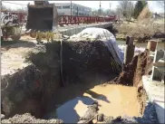 ?? EVAN BRANDT — MEDIANEWS GROUP ?? Repairs to the damaged 20-inch water main at the King Street bridge in Pottstown are expected to be completed Saturday.