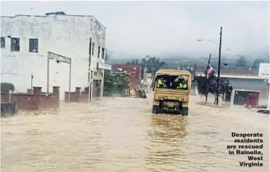  ?? Picture: EPA ?? Desperate residents are rescued in Rainelle, West Virginia