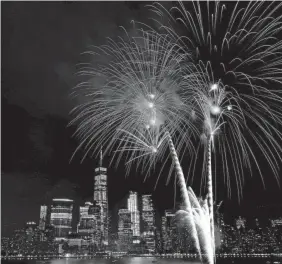  ?? JULIO CORTEZ/AP ?? With the New York City skyline in the background, fireworks explode over the Hudson River during the Fourth of July celebratio­n in 2017.