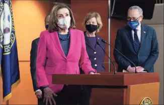  ?? Jacquelyn Martin / Associated Press ?? House Speaker Nancy Pelosi of California, left, with Sen. Tammy Baldwin, D-Wis., center, and Senate Majority Leader Chuck Schumer, D-N.Y., speaks about the Congress Equality Act on Thursday on Capitol Hill in Washington. Behind Pelosi is Rep. David Cicilline, D-R.I.