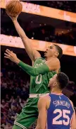  ?? AP ?? Jayson Tatum e Ben Simmons