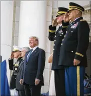  ?? AL DRAGO / THE NEW YORK TIMES ?? Joint Chiefs Chairman Gen. Joseph Dunford (left), Defense Secretary James Mattis and President Donald Trump at Arlington National Cemetery. The president banned transgende­r people from serving in the military Wednesday.