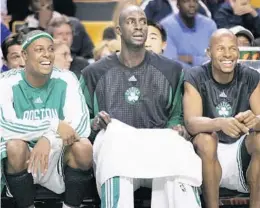  ?? CHARLES KRUPA/AP ?? Times were better back when Paul Pierce, left, Kevin Garnett, center, and Ray Allen first got together in 2007 and took the Boston Celtics from worst to first in one season.