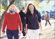  ?? Elizabeth Conley / Associated Press ?? U.S. Rep. Alexandria Ocasio-Cortez, right, joins U.S. Rep. Sylvia Garcia Saturday on a tour of some Houston-area homes that were damaged by the winter storm last week.