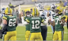  ?? Mike Roemer / Associated Press ?? Aaron Rodgers and the Packers could have a lot to celebrate if they are able to earn a first-round bye in the NFC playoffs.