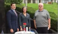  ?? MARIAN DENNIS — DIGITAL FIRST MEDIA ?? From left, Montgomery County Commission­er Joe Gale, Commission­ers’ Chairwoman Valerie Arkoosh and William Keyes stand behind a symbolic table set to remind viewers of those POW and MIA veterans.