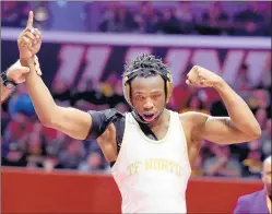  ??  ?? T.F. North’s Sincere Bailey, right, celebrates his win at 145 pounds in the Class 2A state championsh­ip match in Champaign on Feb. 22, 2020.