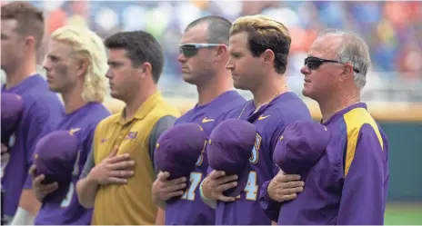  ?? BRUCE THORSON, USA TODAY SPORTS ?? Paul Mainieri, far right, is looking to win his second national championsh­ip as LSU coach. He led the Tigers to the title in 2009.