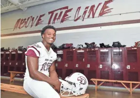  ?? SARAH WARNOCK, CLARION LEDGER ?? Nakobe Dean, one the highest rated players in Mississipp­i, sits in the locker room of Horn Lake High School.