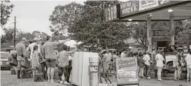  ?? Vanesa Brashier / The Advocate file ?? Customers wait to buy fuel at a gas station in Cleveland after Hurricane Ike in 2008. U.S. gasoline demand fell after Ike hit Texas.