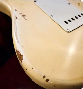  ?? ?? 9. Glimpses of the distinctiv­ely streaked grain of korina can be seen through chips and worn areas in this 1964 Strat’s Olympic White finish 9