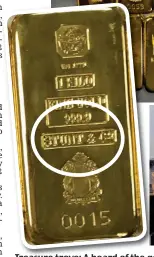  ?? ?? Treasure trove: A hoard of the gold bars with Stunt & Co embossed on them, circled. Right, Stunt with Petra Ecclestone